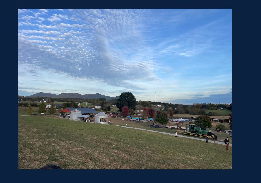 Rolling hills and open farmland in East Tennessee under a blue sky with scattered clouds