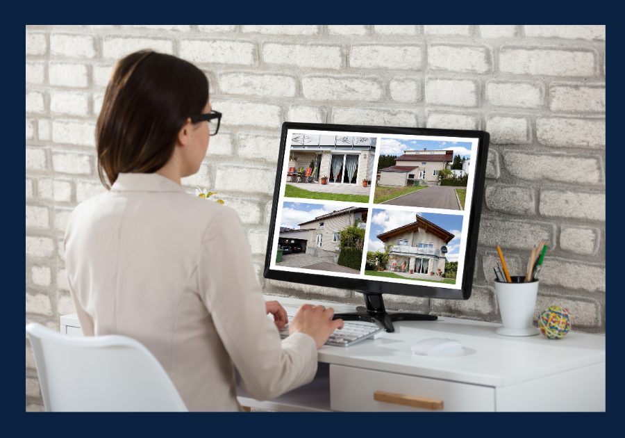 Homebuyer reviewing multiple property listings on a computer while comparing homes online