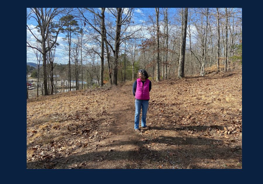 East Tennessee REALTOR® Melody Wagstaff walking on wooded trail in Kingston Tennessee