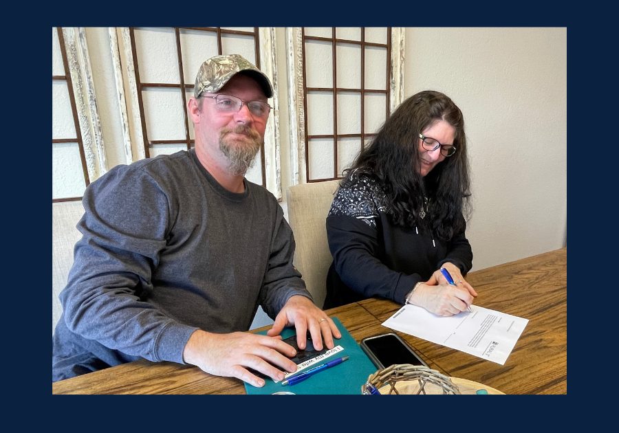 East Tennessee homebuyers signing closing documents during a real estate transaction