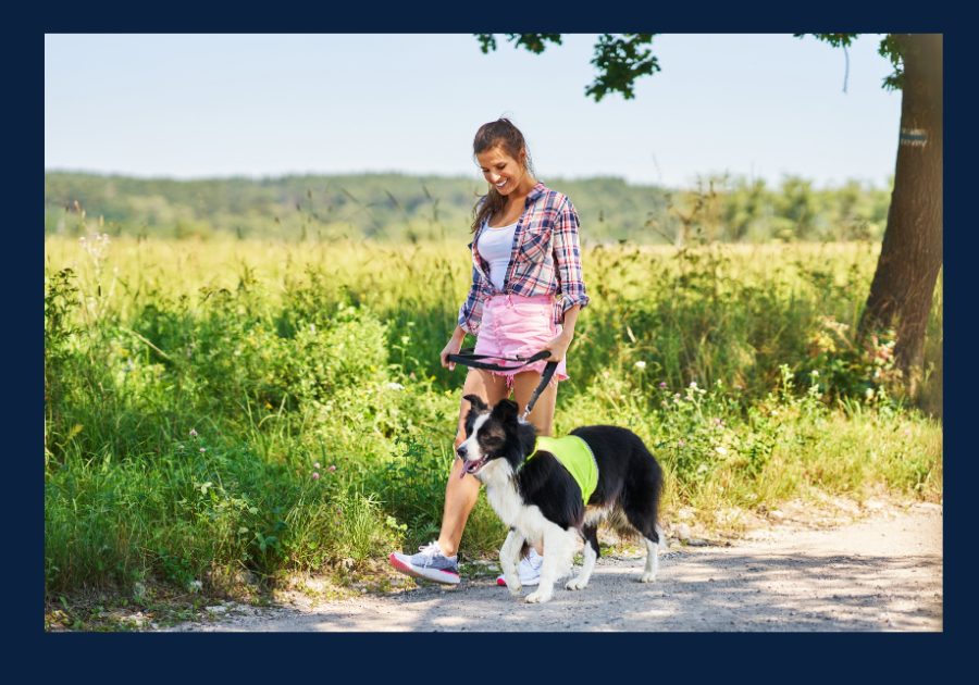 Woman walking her dog along a path in a peaceful East Tennessee setting