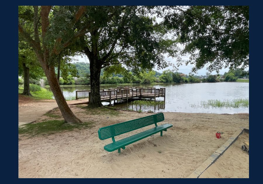 Anchor Park in Knoxville Tennessee featuring a lakeside dock, sandy shoreline, park bench, and peaceful waterfront setting.